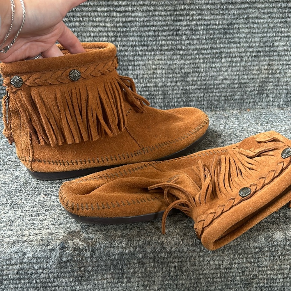 Minnetonka booties, zip backs. Like new condition.